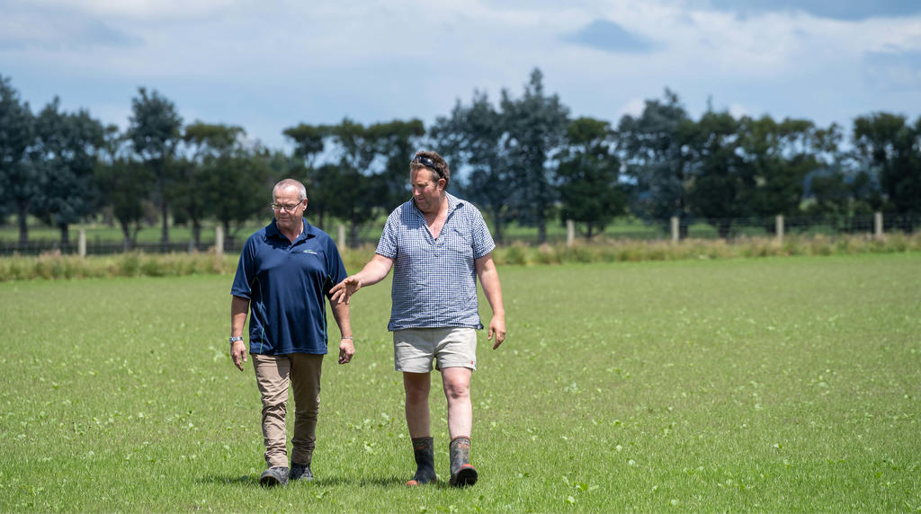 PGW Staff and customer walking in a field